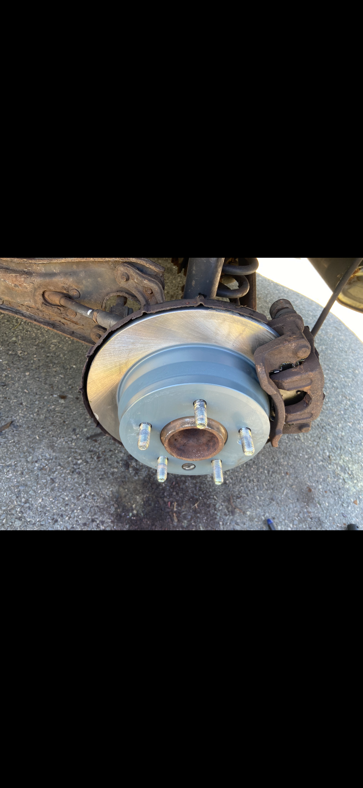 New brake rotor installed on front axle hub