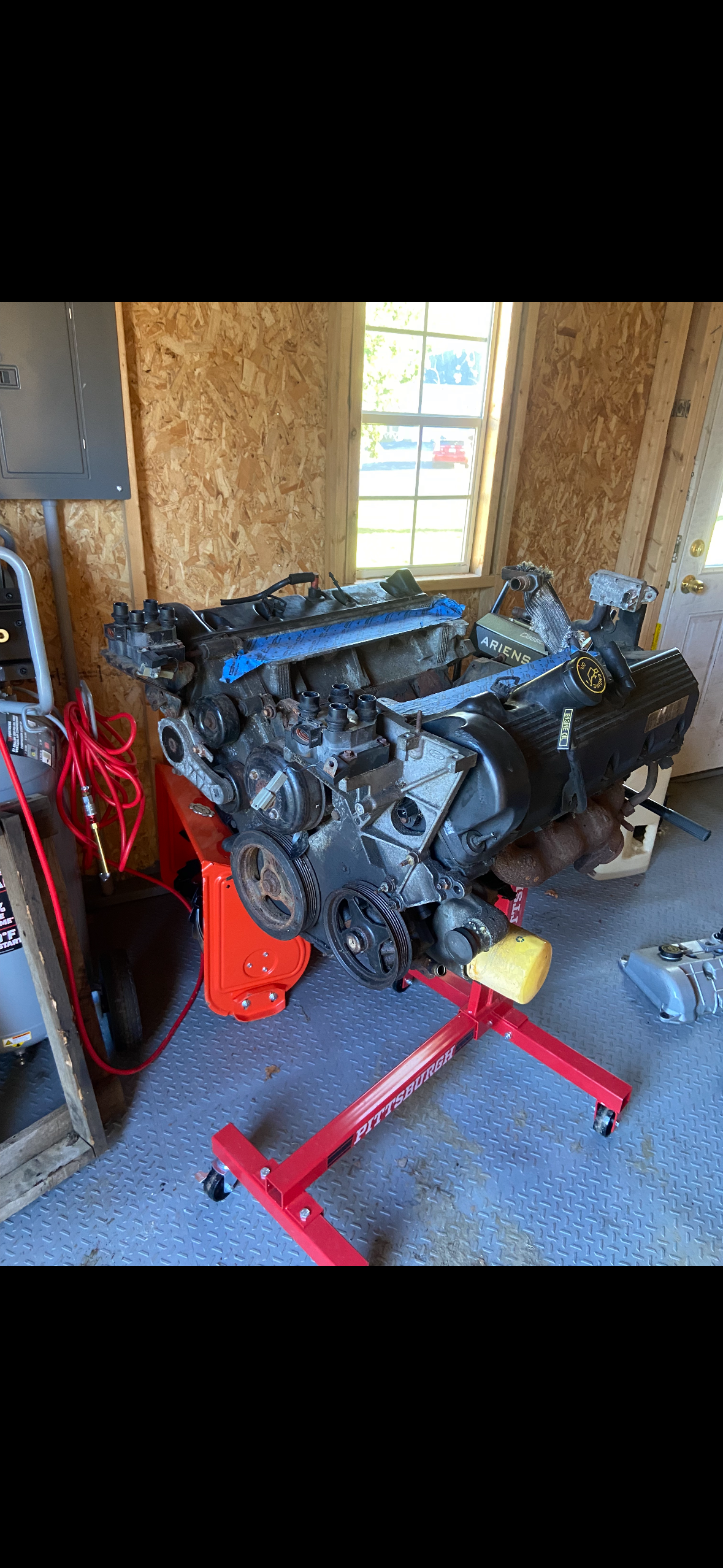 Full engine pull on an engine stand inside the shop